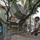 Indian security personnel stands near a collapsed house after an earthquake in Siliguri (EPA/Narendra Shrestha)
